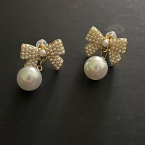 Elegant Pearl Bow Earrings. Both pairs sold together.